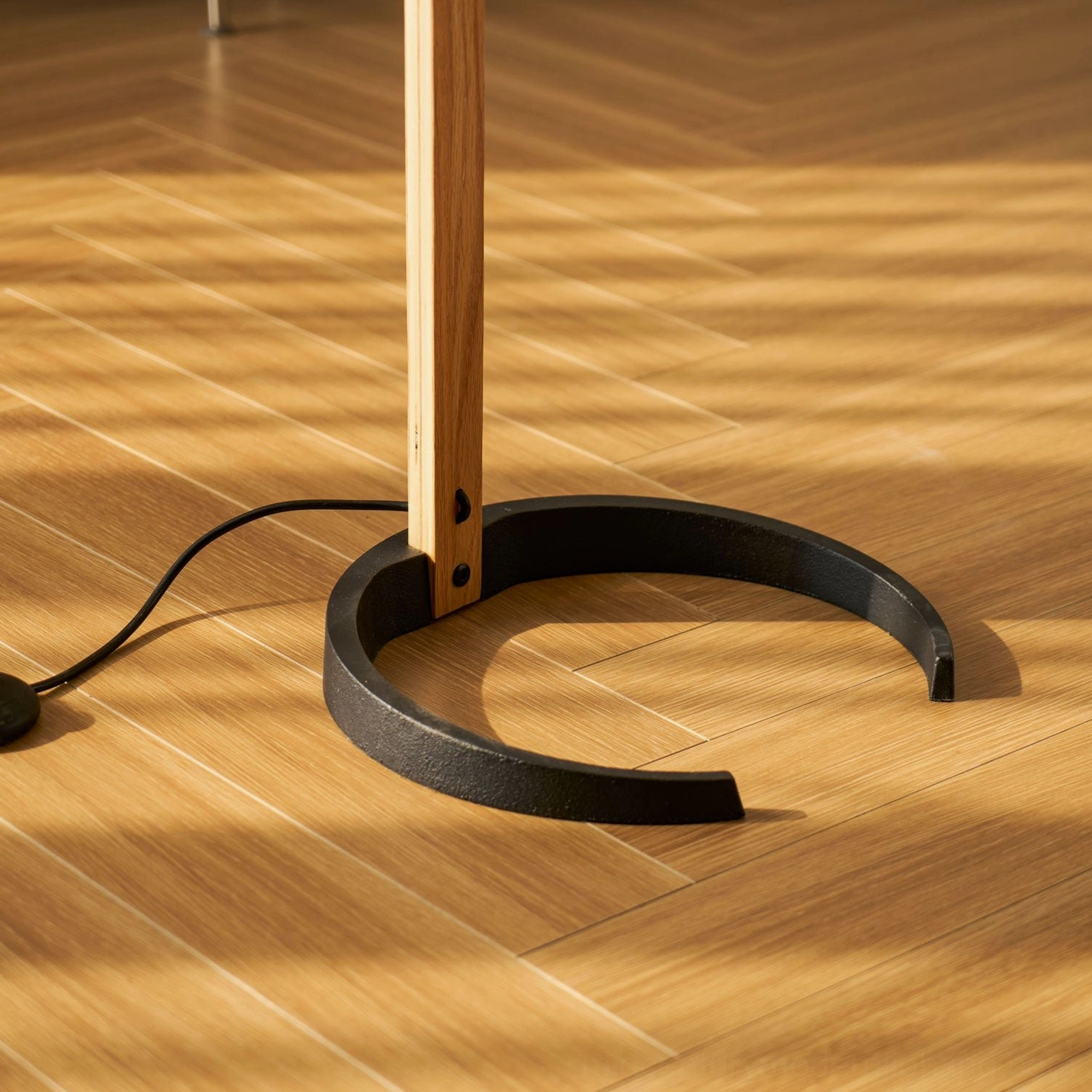 Caprani beech wood floor lamp curved stand design detail showing craftsmanship