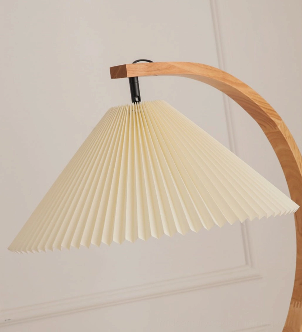 Close-up detail of Caprani lamp shade and wood grain stand, cream pleated fabric with natural solid wood