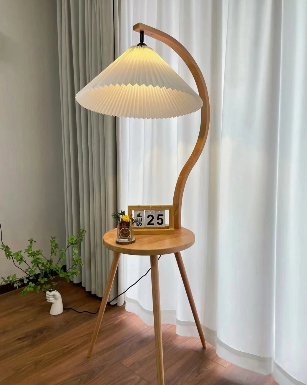 Caprani mid-century floor lamp styled in eclectic home interior with decorative accents