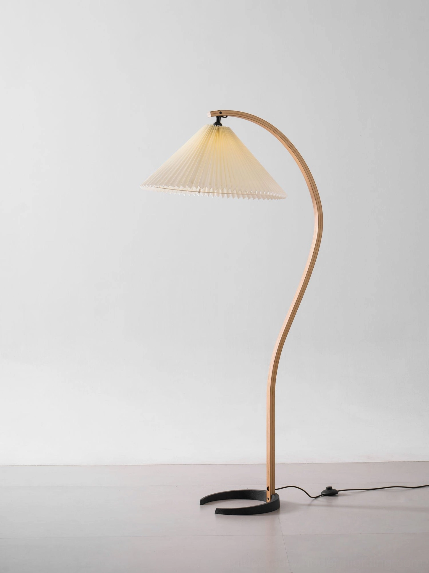 Caprani floor lamp in contemporary minimalist space with clean lines and neutral palette