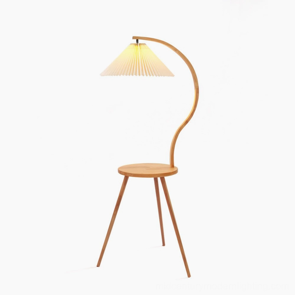 Caprani mid-century modern floor lamp with integrated side table, curved solid wood stand, and cream pleated linen shade on white background