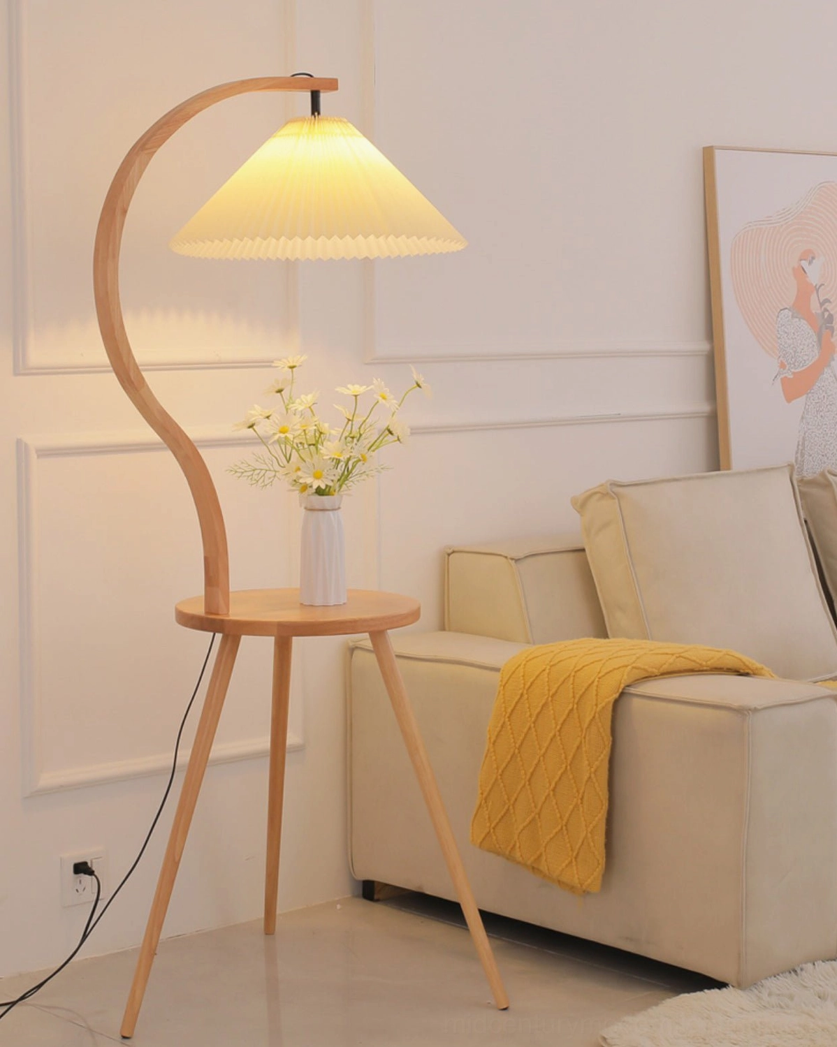 Caprani mid-century modern floor lamp in contemporary living room with curved wooden frame and yellow throw blanket