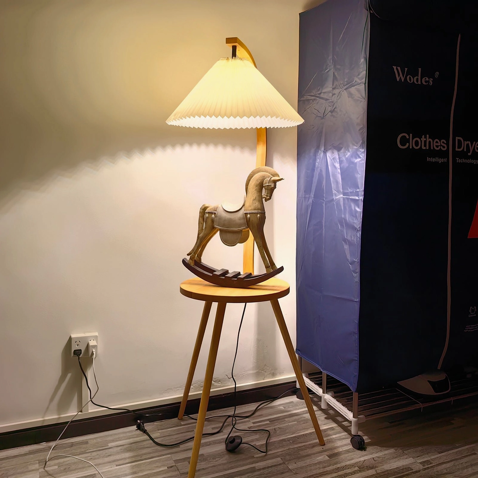 Caprani modern tray lamp with pleated fabric shade and curved wooden frame detail