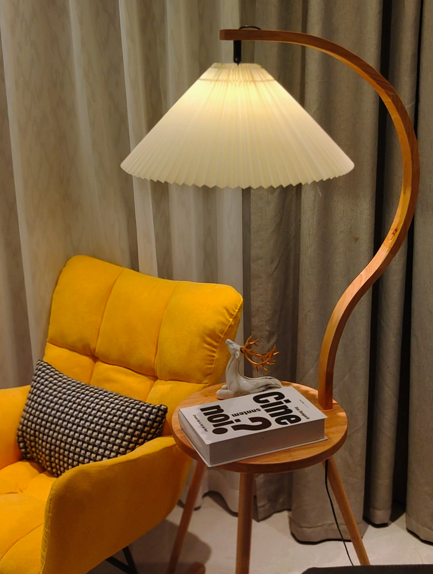 Caprani floor lamp with natural wood finish and pleated linen shade for soft warm lighting