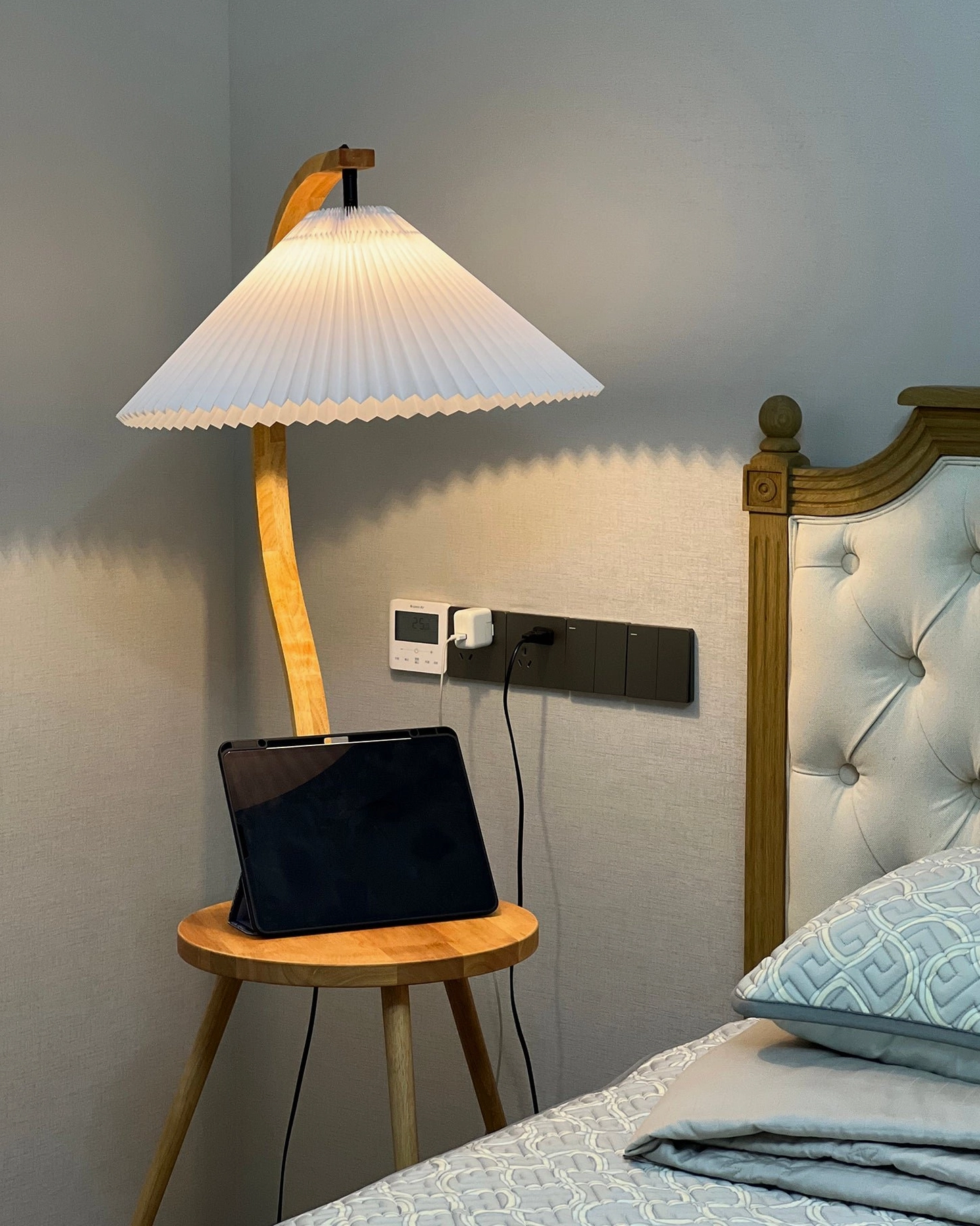 Caprani tray floor lamp showcasing natural wood grain and sculptural design in home interior