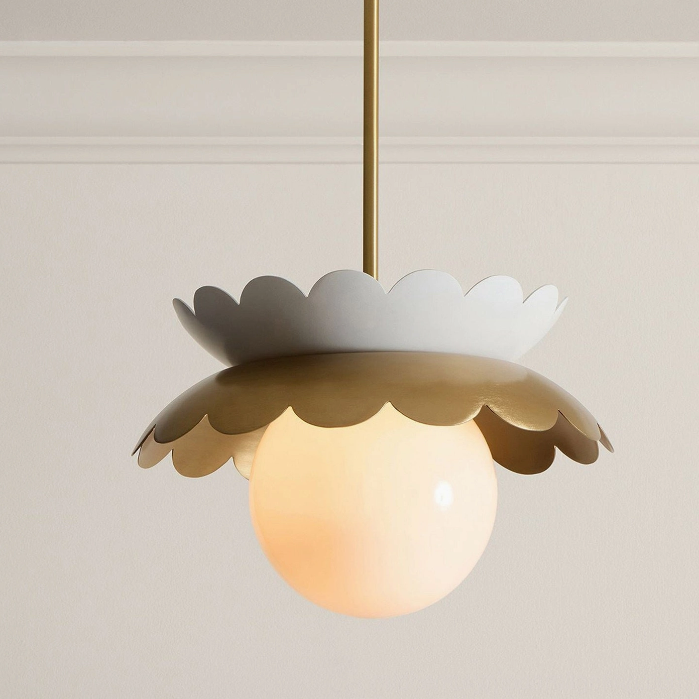 Capri globe pendant light front close-up showing dual-tone scalloped metal trim and frosted glass