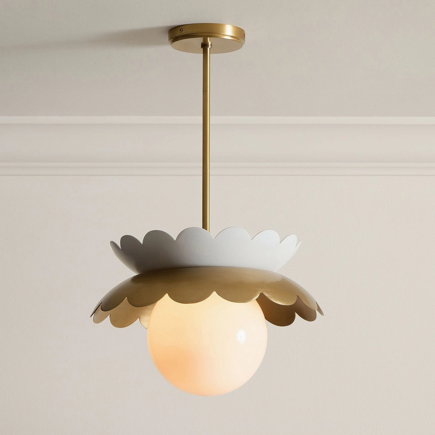 Capri scalloped globe pendant featuring frosted glass and gold brass finish architectural detail
