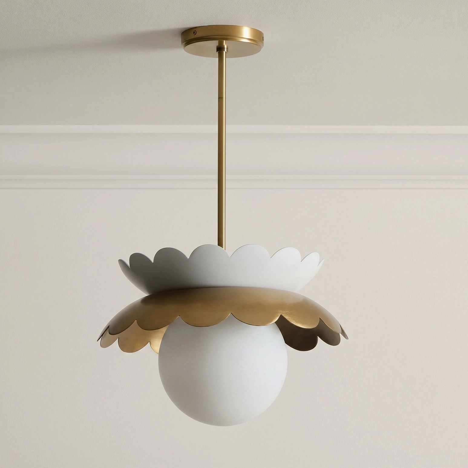 Capri pendant light with brass hardware and white spherical frosted glass globe studio shot