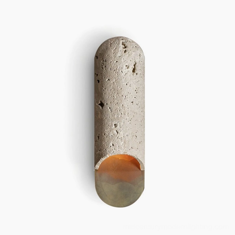Front presentation of beige travertine capsule wall lamp with porous texture and warm base glow on white studio background