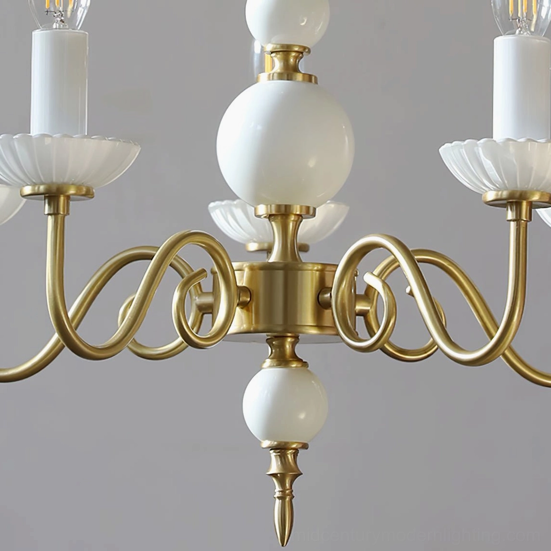 Carlita 4-light chandelier close-up top view showing brushed gold frame and intricate scrollwork