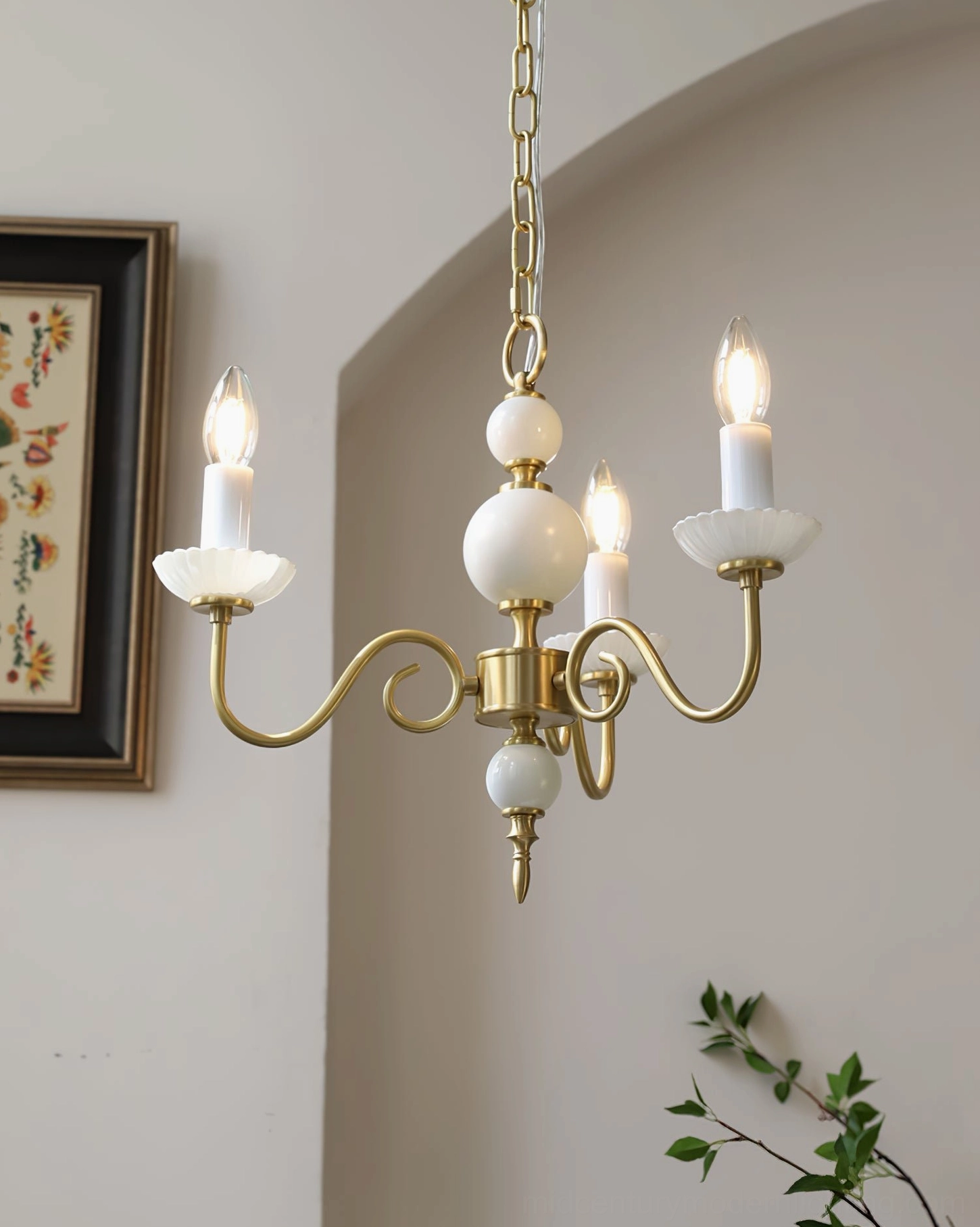 Carlita 5-light brass chandelier displaying warm gold finish and sculptural form