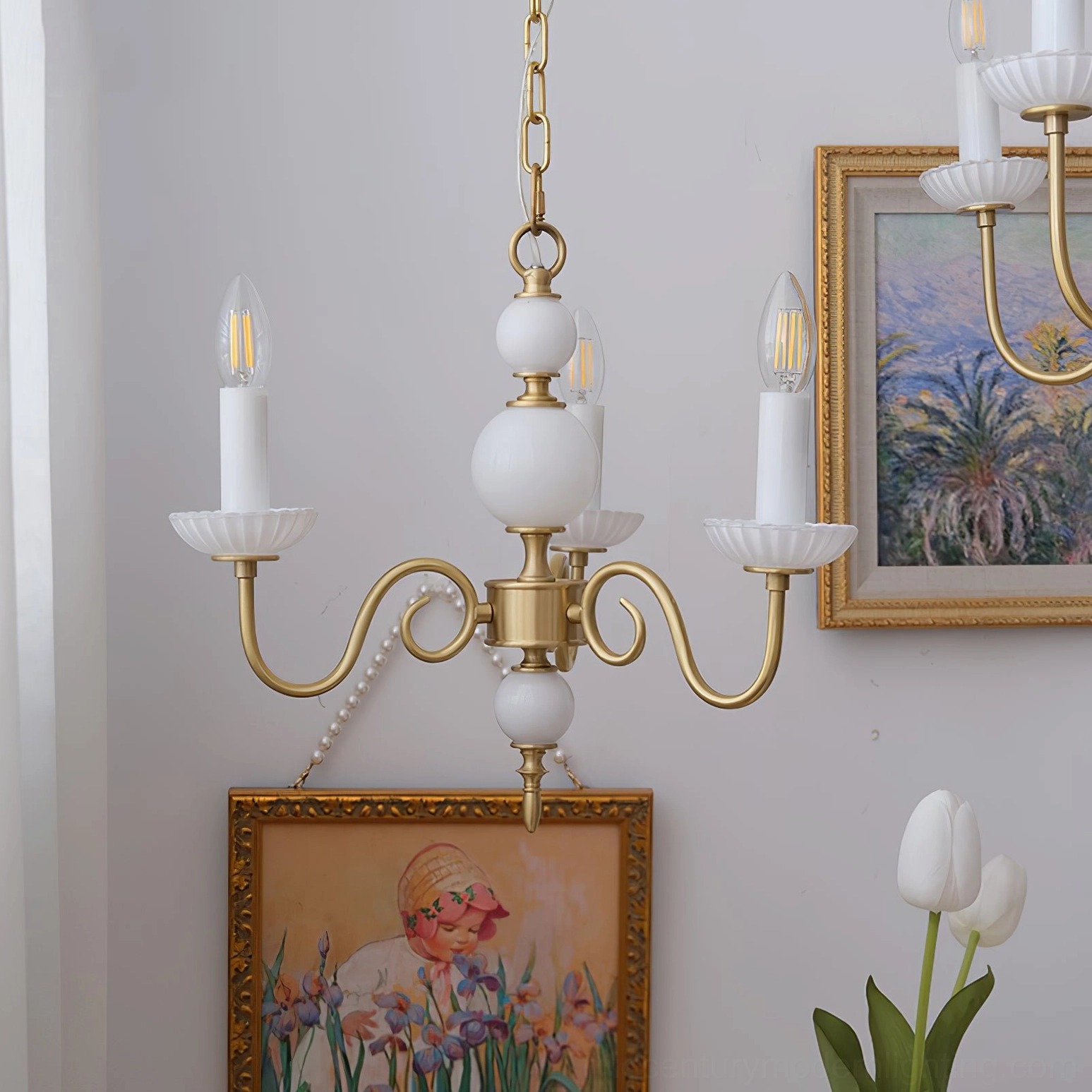 Carlita 6-light brass chandelier with scalloped lamp bases and white ceramic spheres in interior