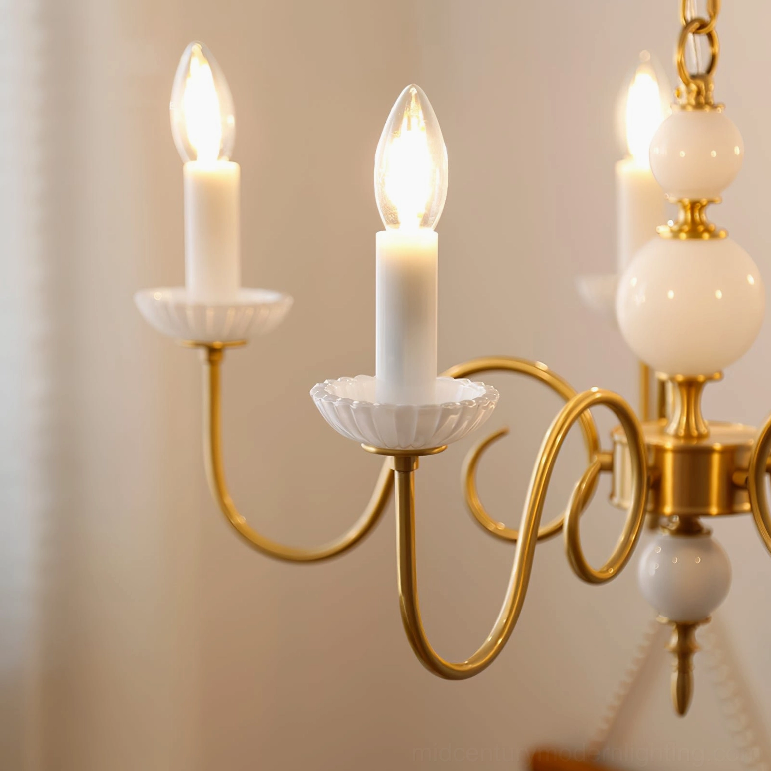 Carlita brass chandelier installed in gallery-style space highlighting architectural details