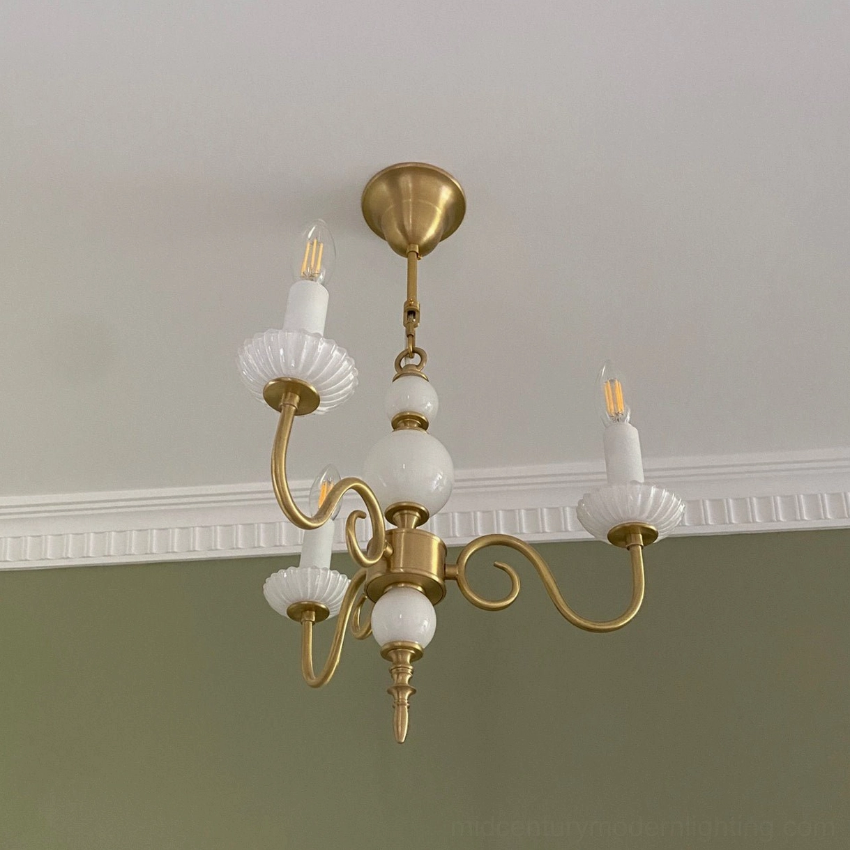 Carlita multi-light brass chandelier in luxury home interior with sophisticated styling