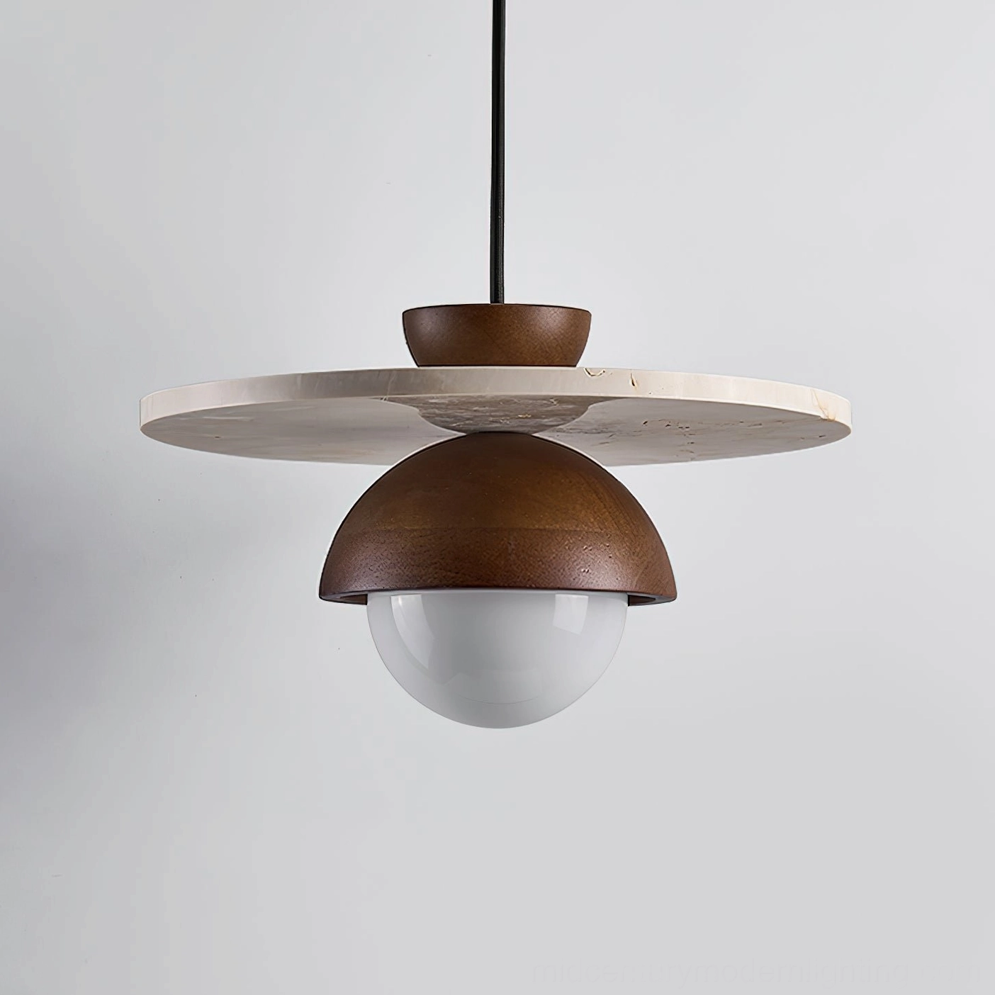Cassini pendant lamp with dark wood finish and black hanging cord on white studio background
