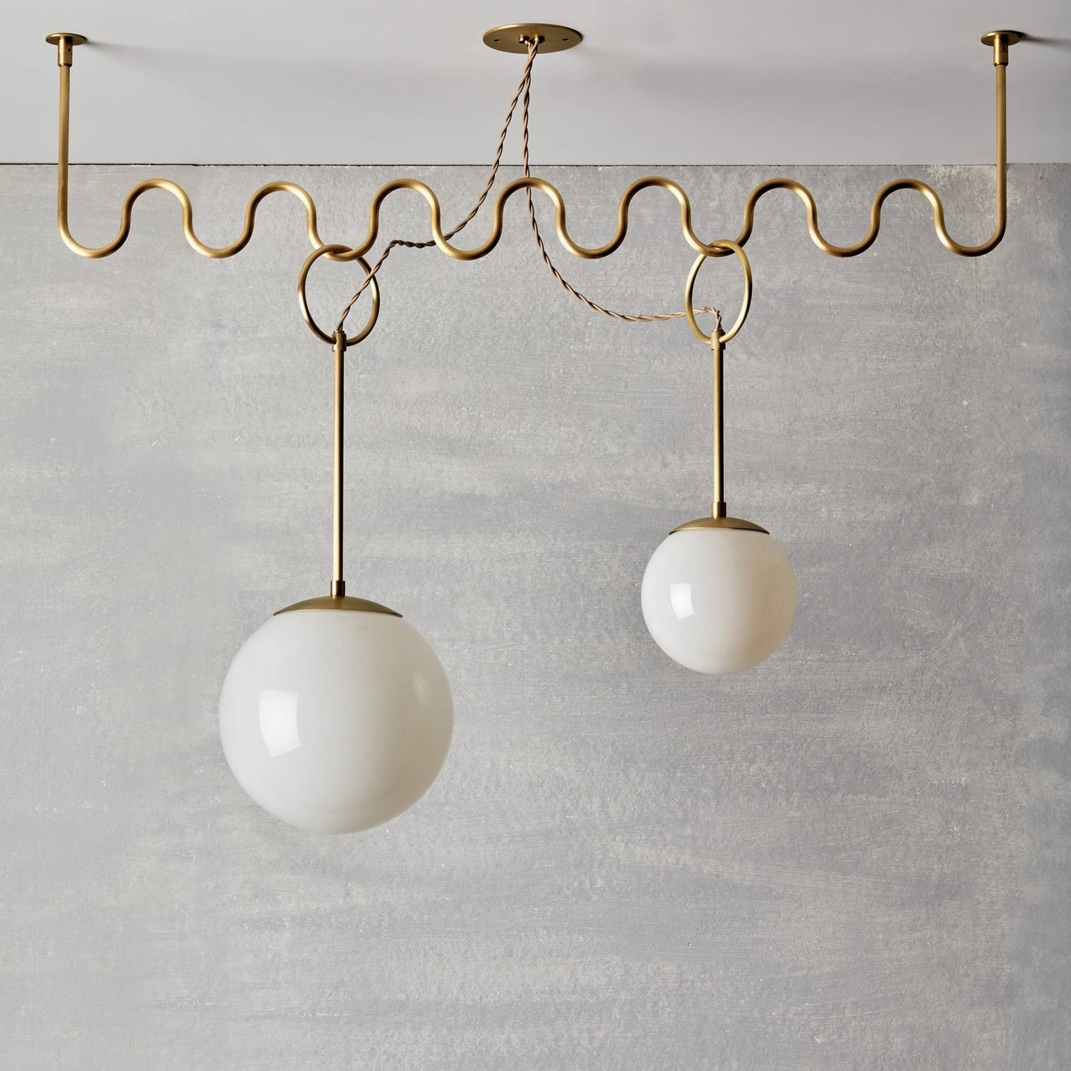 Cecil chandelier styled in contemporary interior with minimalist décor and textured wall background