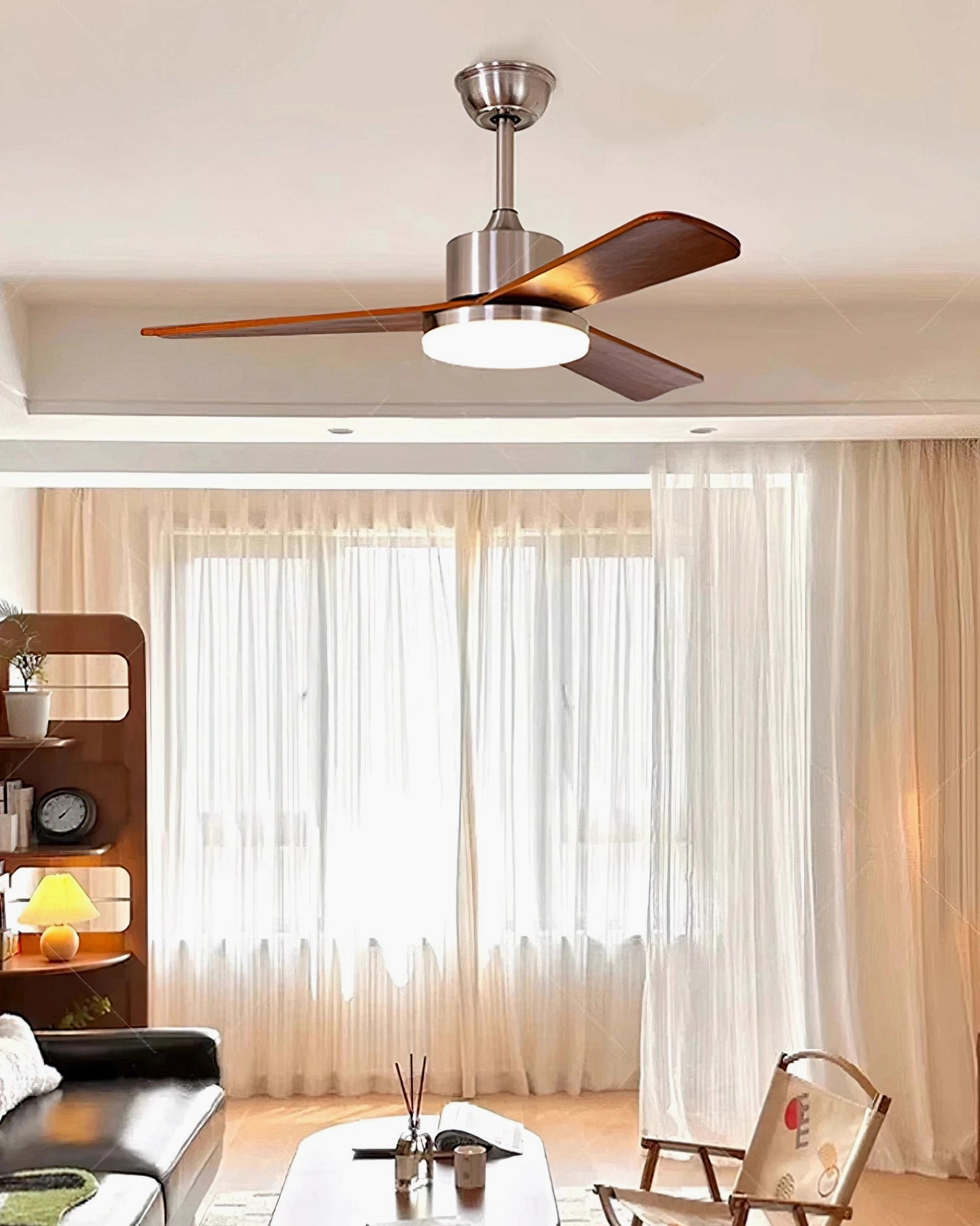 Bright airy living room featuring integrated LED ceiling fan light with neutral interior palette and sheer window curtains