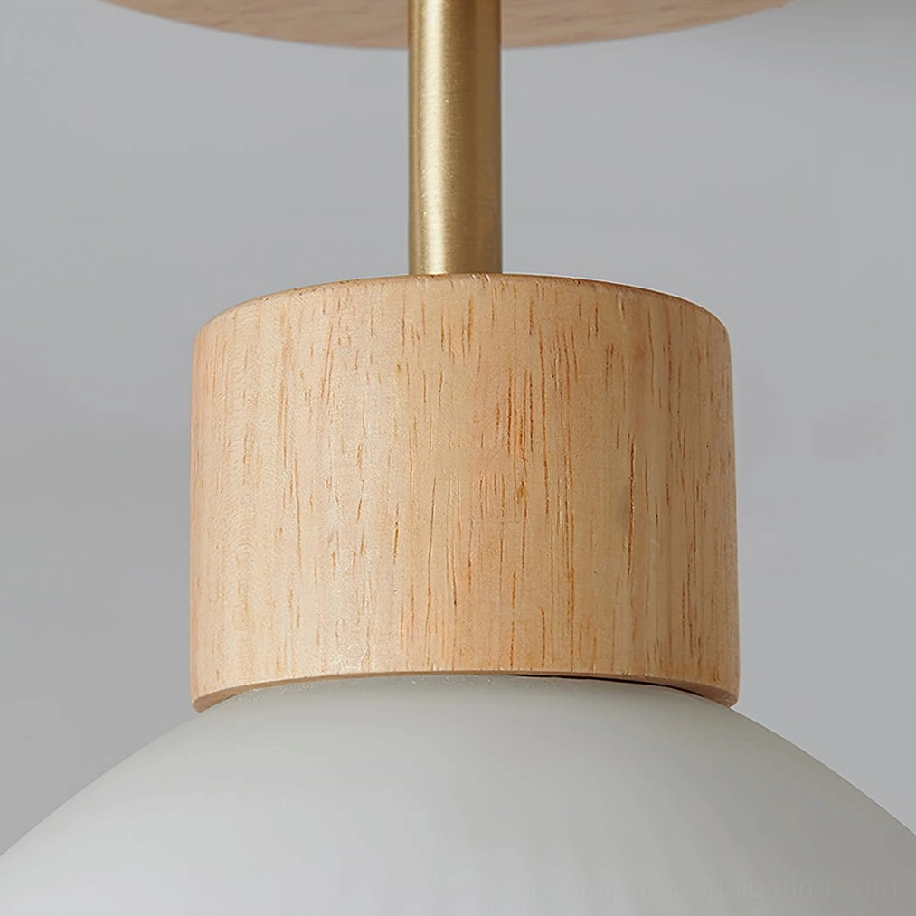 Ceiling lamp mounting hardware and brass metal rod detail with wood base connection