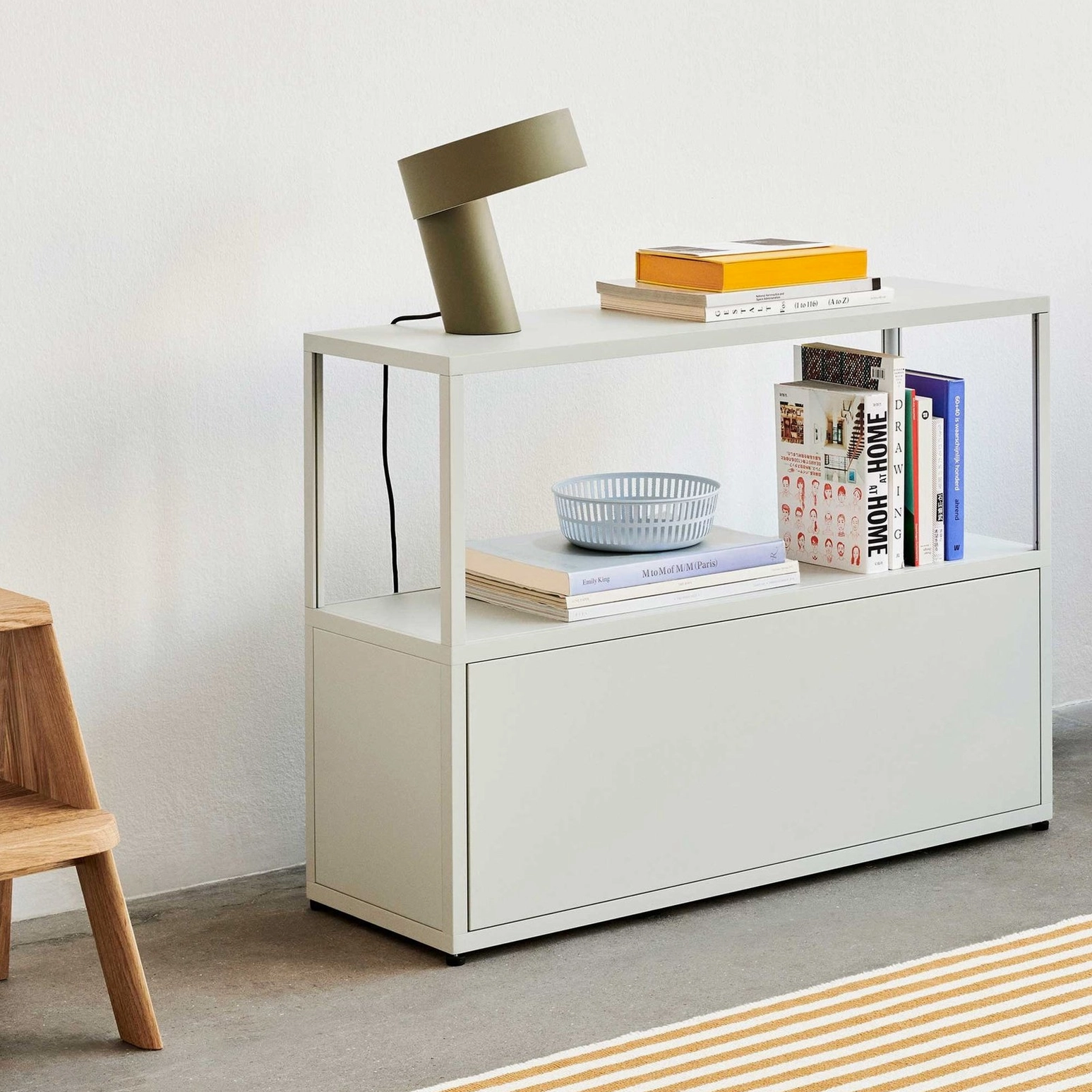 Celia angular LED table lamp on styled shelf, modern minimalist lighting solution