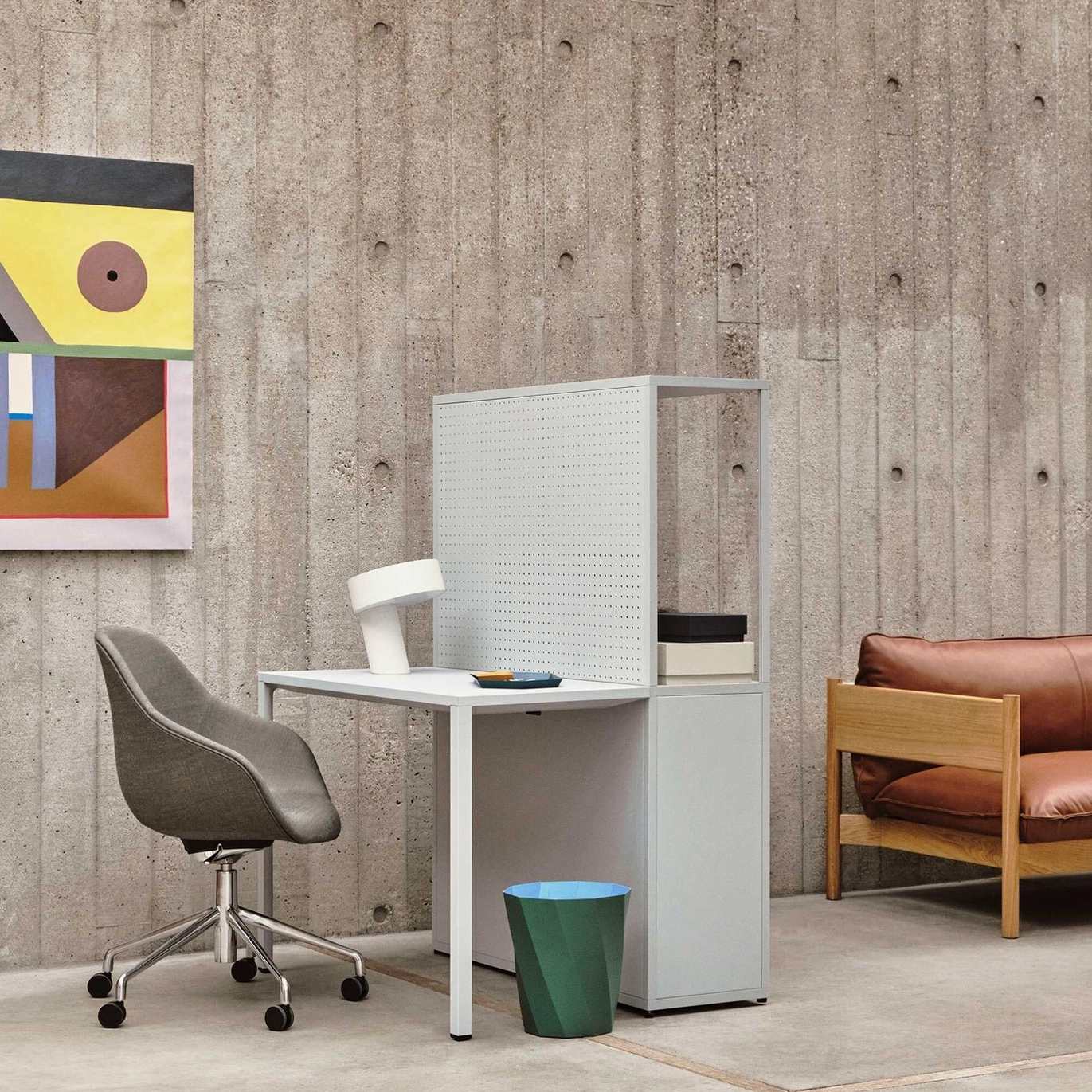 White Celia minimalist table lamp in home office nook with modern chair and abstract wall art, workspace design