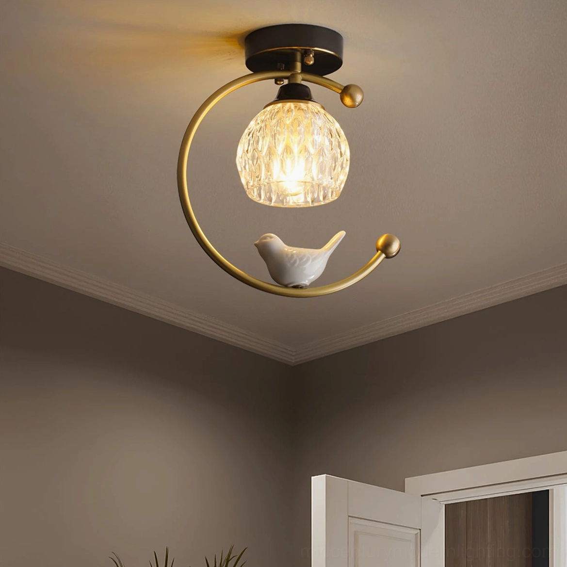 Black ceramic bird ceiling lamp fixture showing mid-century modern design and craftsmanship