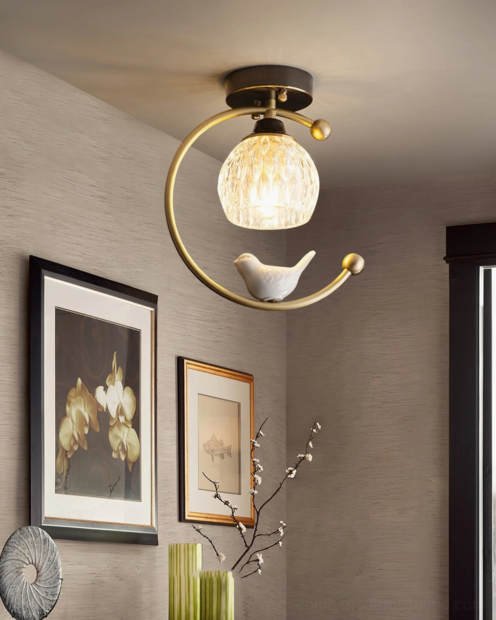 Ceramic bird ceiling lamp architectural detail showing solid brass frame construction and finish