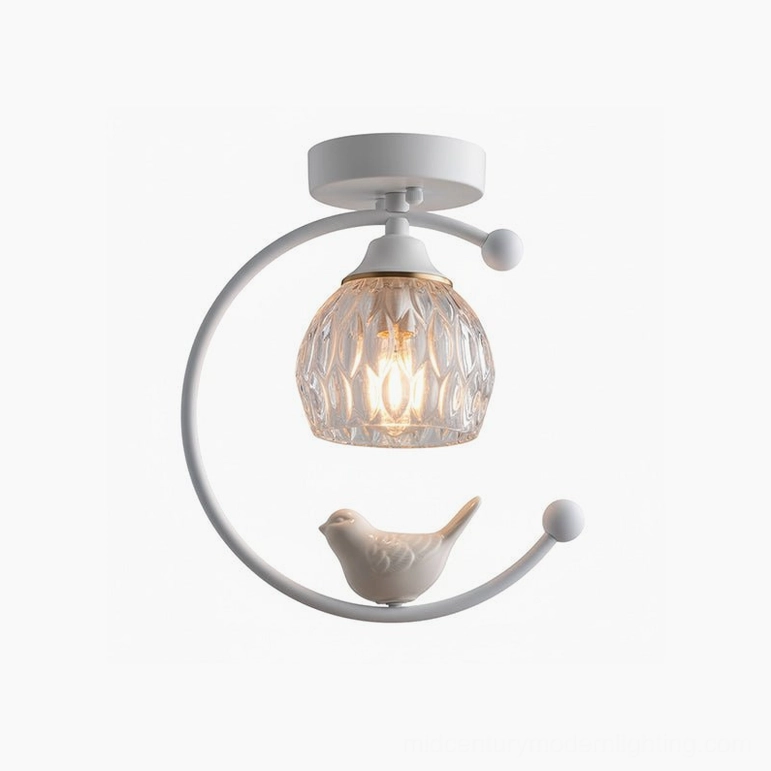 White ceramic bird ceiling lamp in neutral interior creating subtle artistic presence
