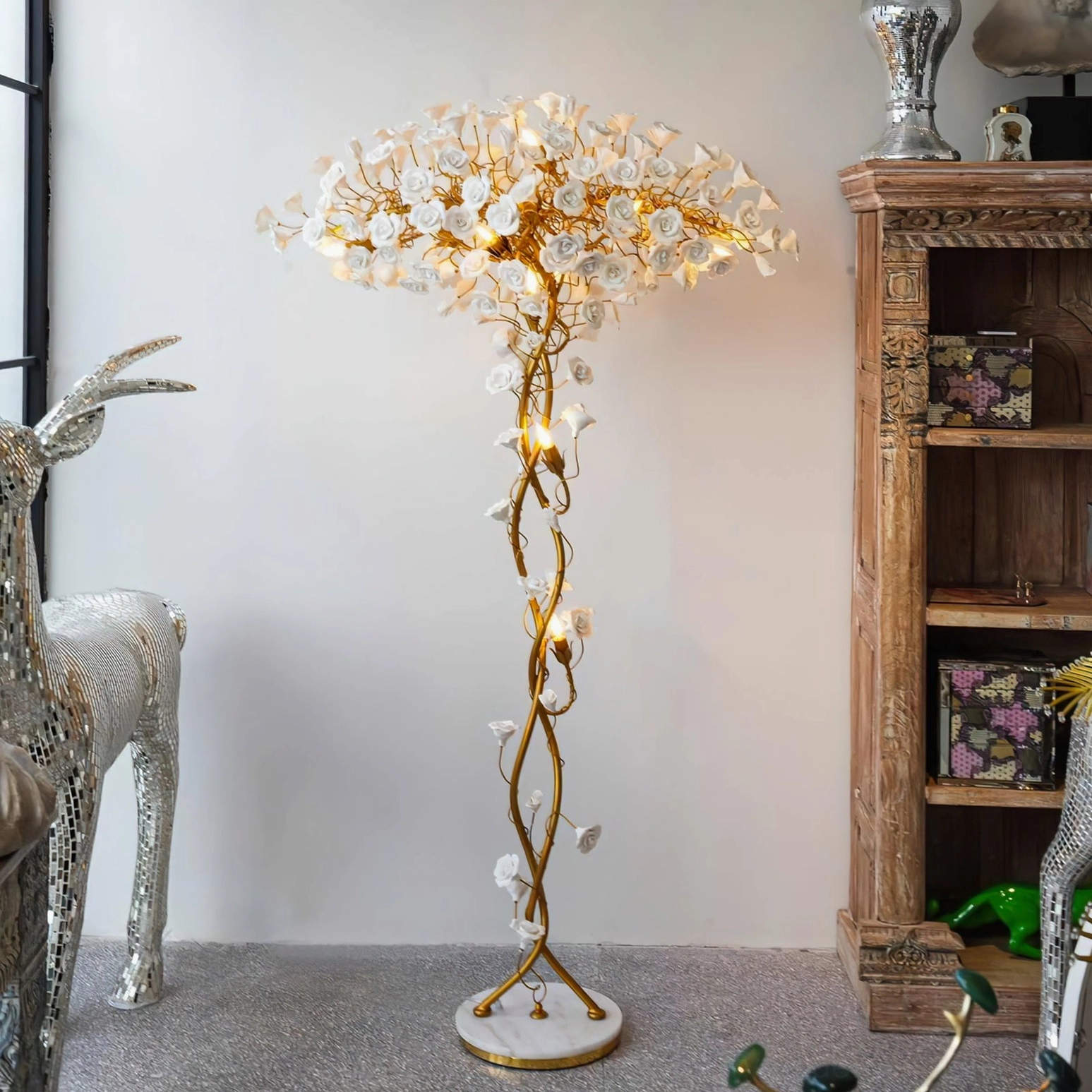 Ceramic flower brass floor lamp in vintage luxury living room with wooden cabinet and decorative silver deer statue