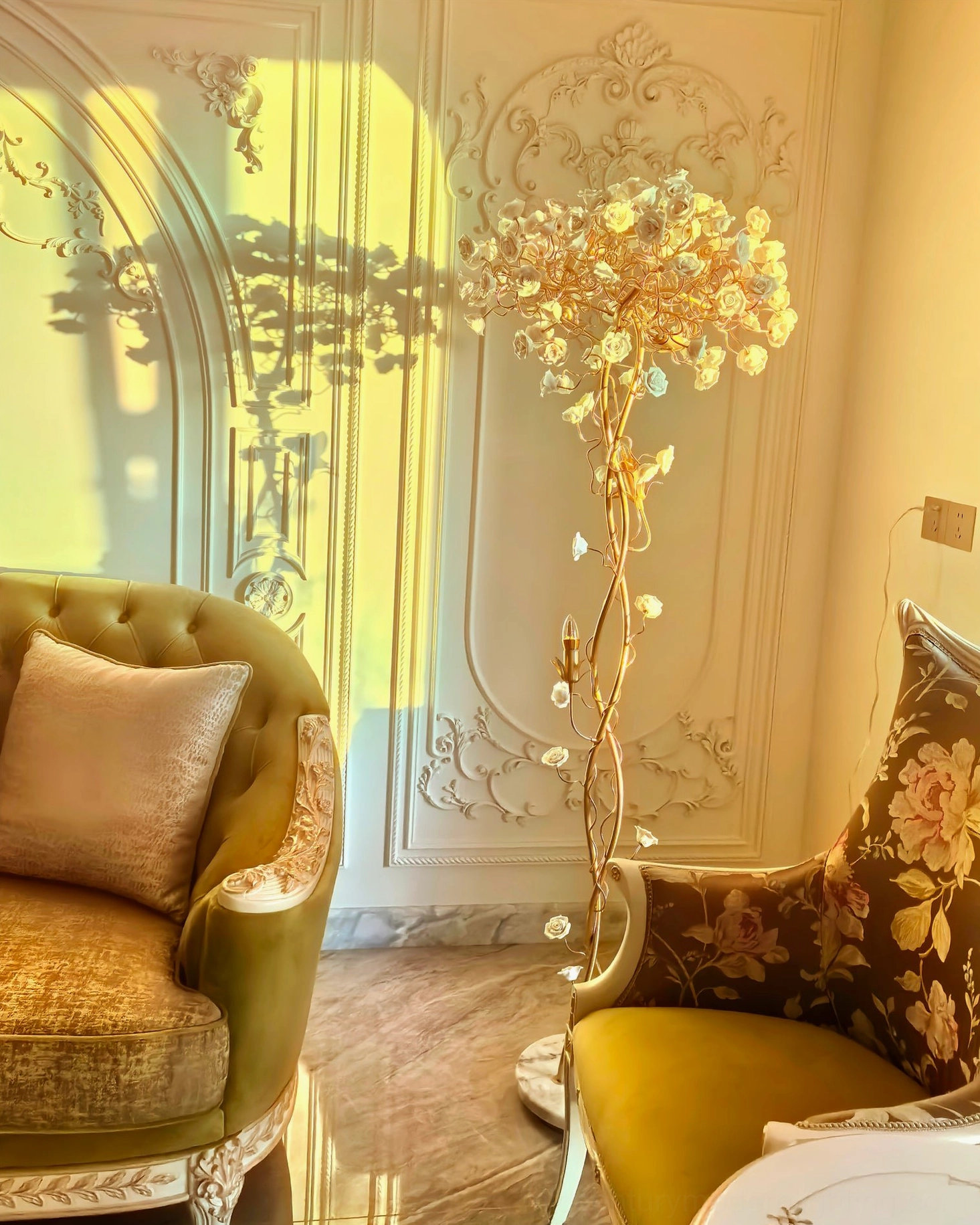 Ceramic flower floor lamp in European luxury living room casting floral shadow patterns on carved wall