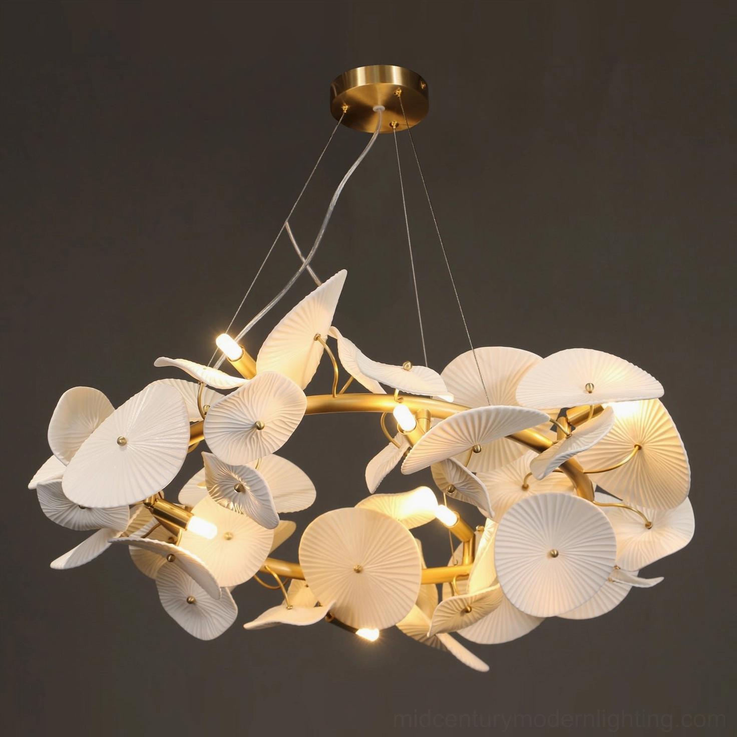 Ceramic wreath chandelier artistic composition with white petals and gold brass accents demonstrating sculptural design excellence