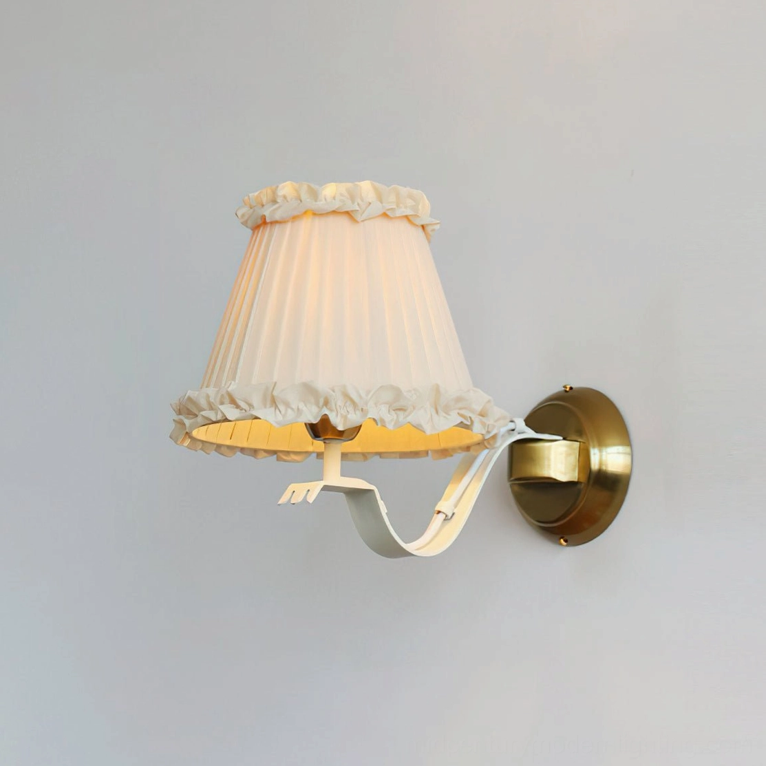 Chantal ruffle wall sconce beige and gold variant in styled room with French country aesthetic