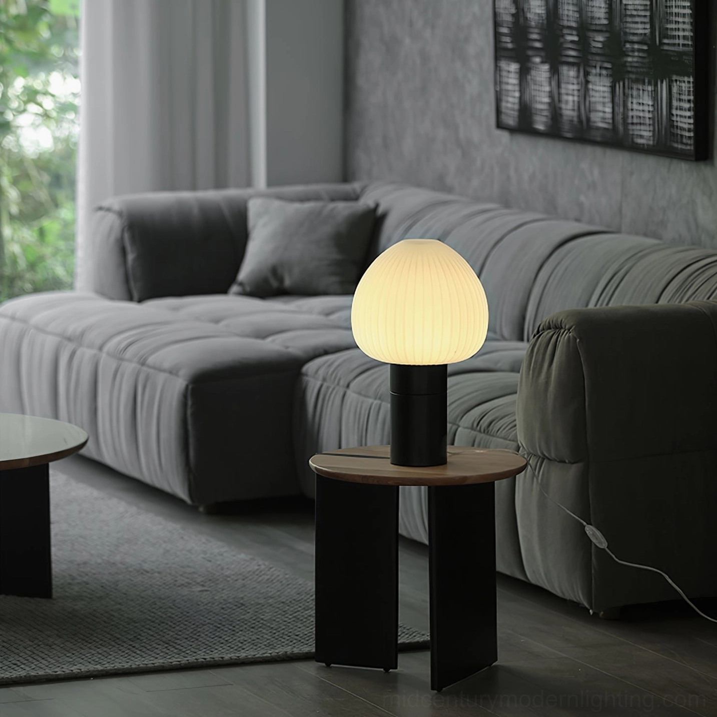 Chanya marble lamp glowing in contemporary living room with grey fabric sofa, ambient home lighting ambiance
