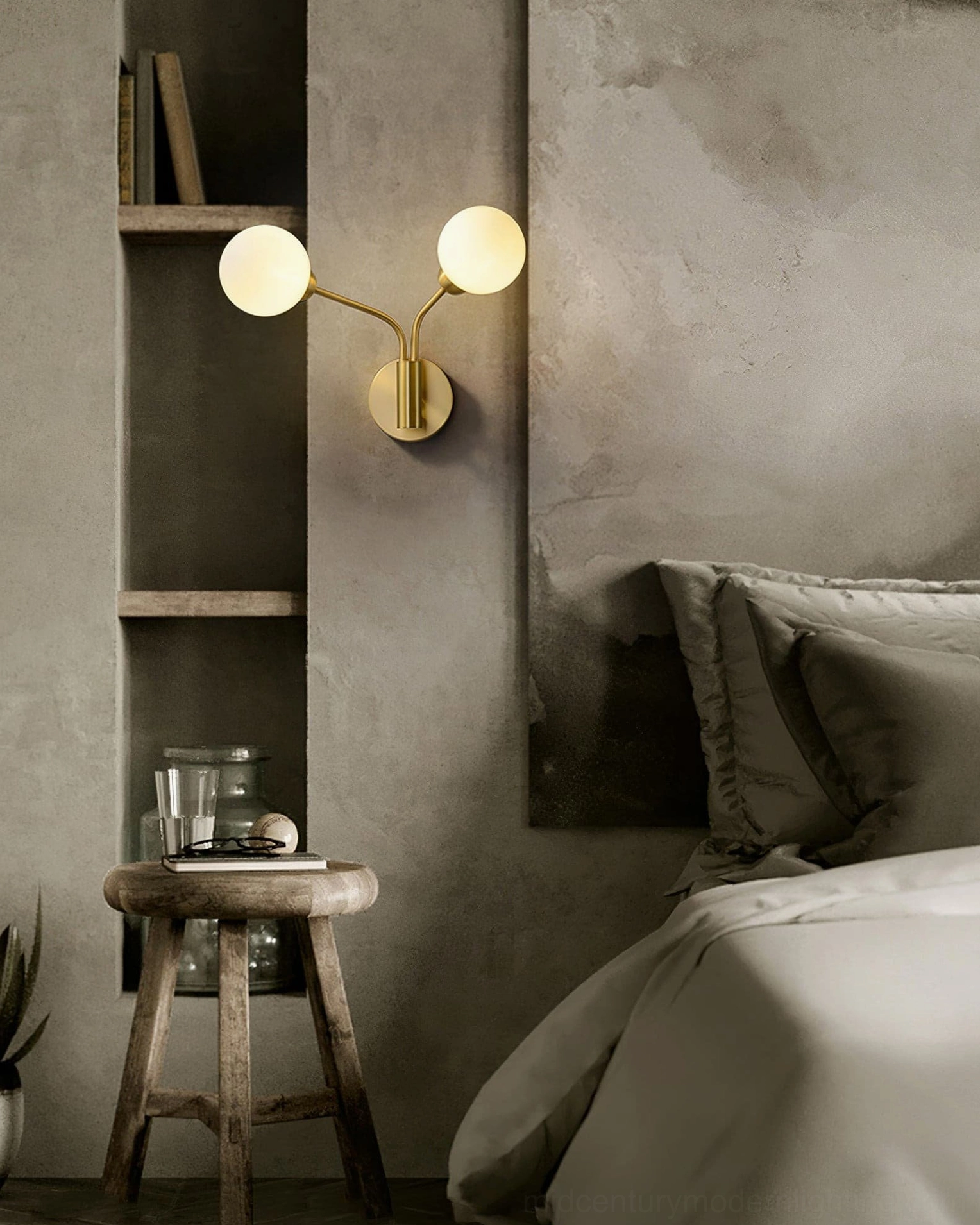 Chelso two-light wall sconce installed in bedroom above wooden shelf