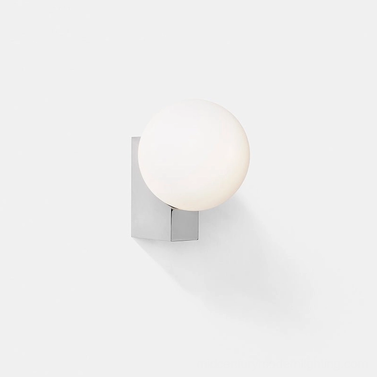 Contemporary wall sconce with polished chrome finish and frosted glass globe in modern minimalist style