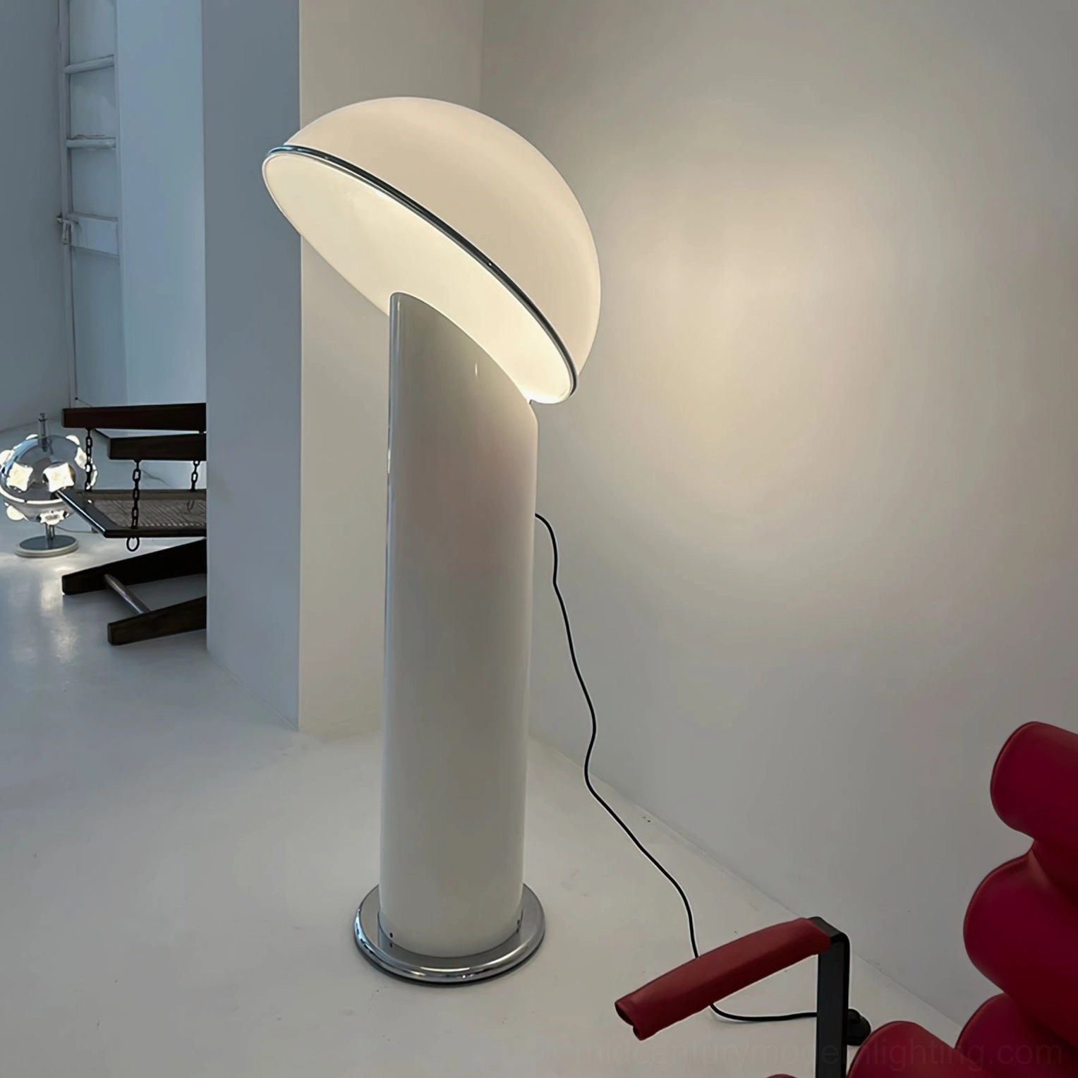 Ciot modern floor lamp full view with black glossy base and large white dome in contemporary setting