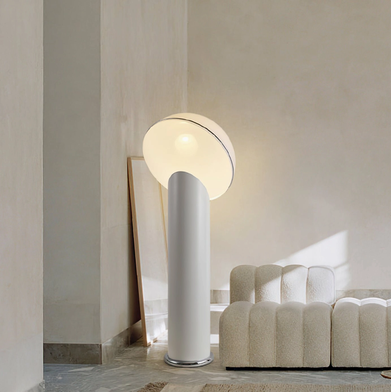 Ciot modern floor lamp with white dome shade and black base in minimalist studio with shelf