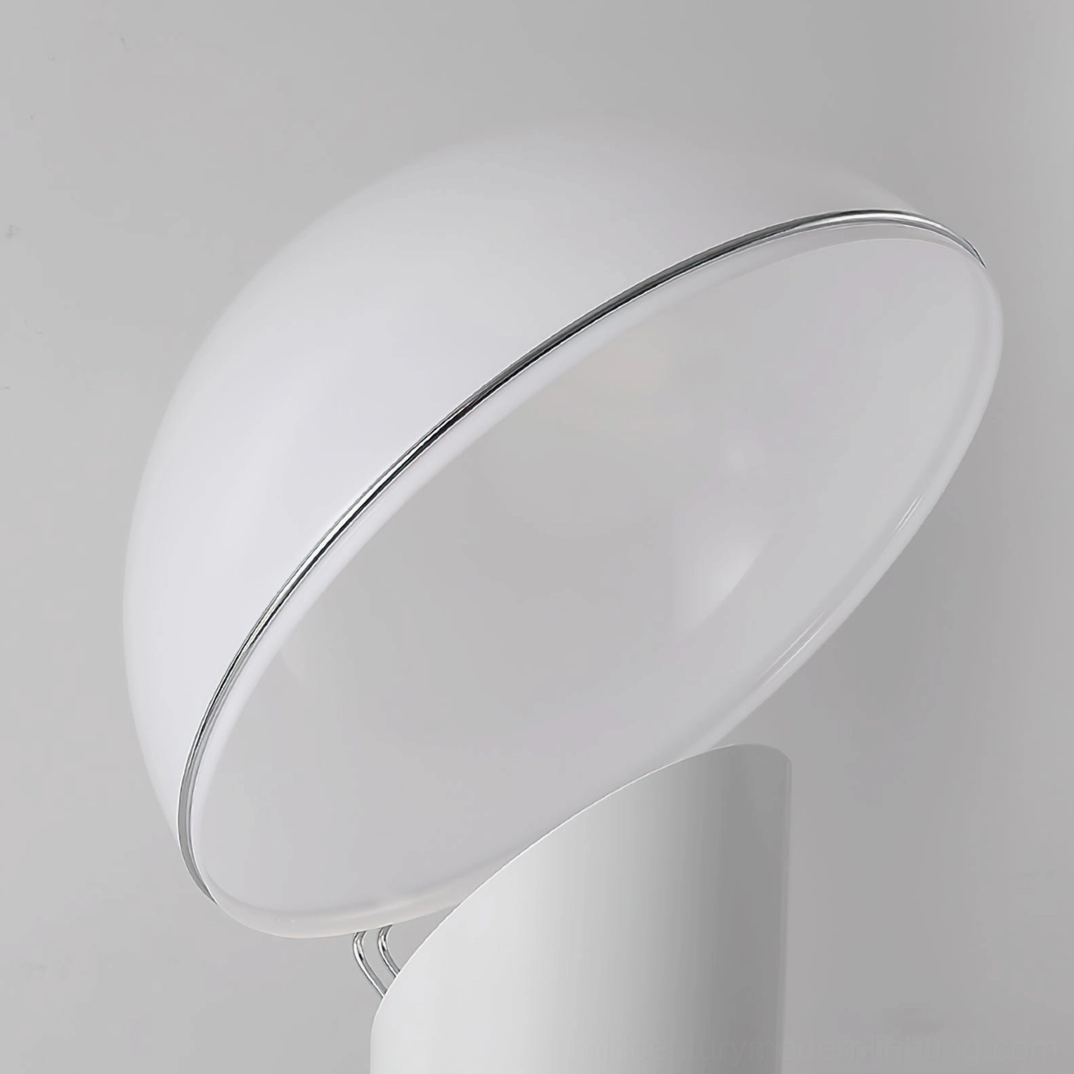 Ciot sculptural floor lamp showcasing sleek black metal support and large white frosted dome