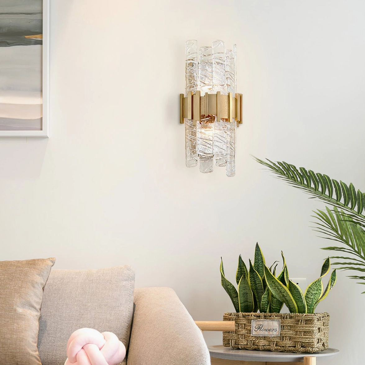 Ciro dual-light wall sconce creating ambient lighting in modern living room with plants