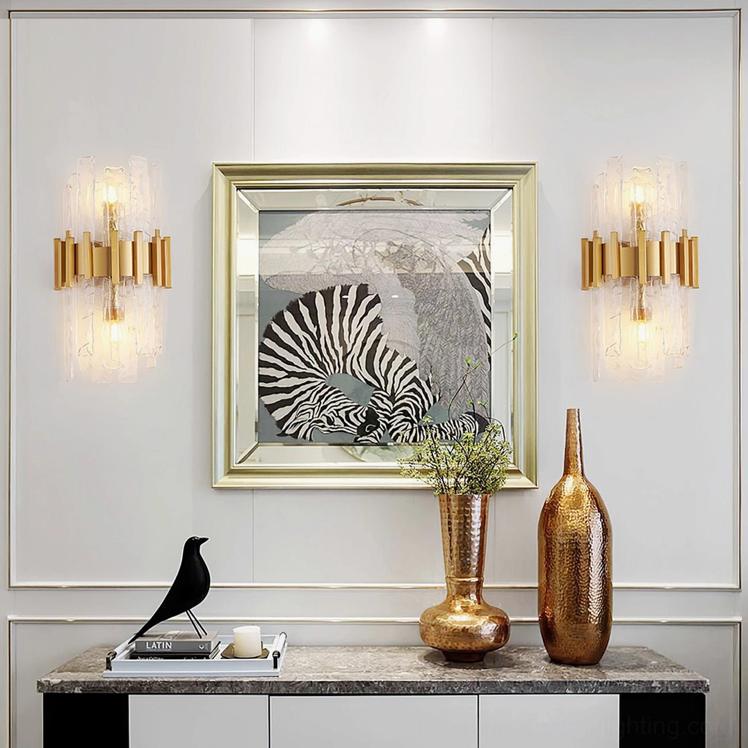 Contemporary dual-light sconce with sculptural gold frame and diffusing glass