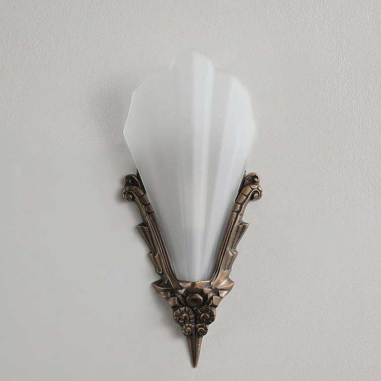 Unlit Claridge Glass Wall Sconce displaying aged bronze base and frosted glass cylinder shade