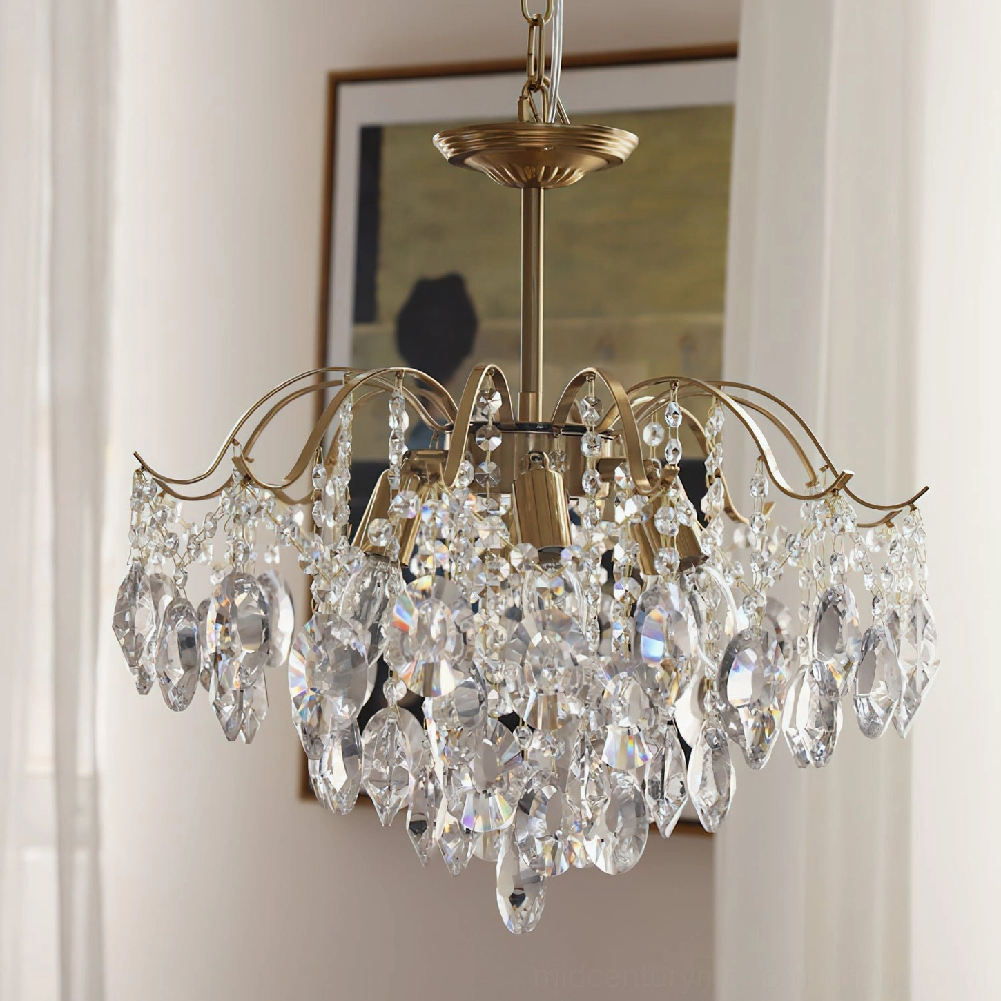 Clear crystal chandelier front view with transparent drop crystals and polished brass hardware in soft natural light