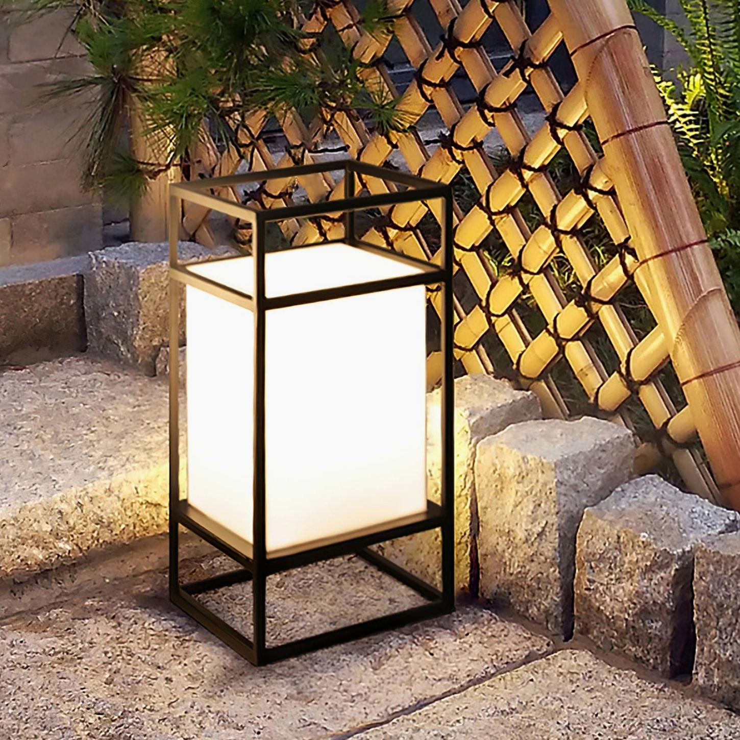 Cleo outdoor patio lantern stone courtyard bamboo fence Japanese garden setting