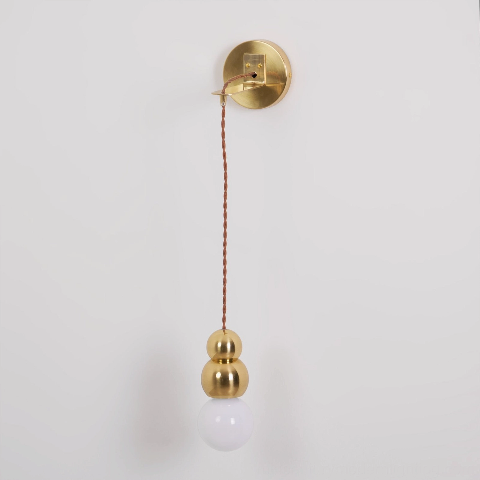 Clustered ball wall lights in hallway, geometric pendant arrangement, multiple fixture display