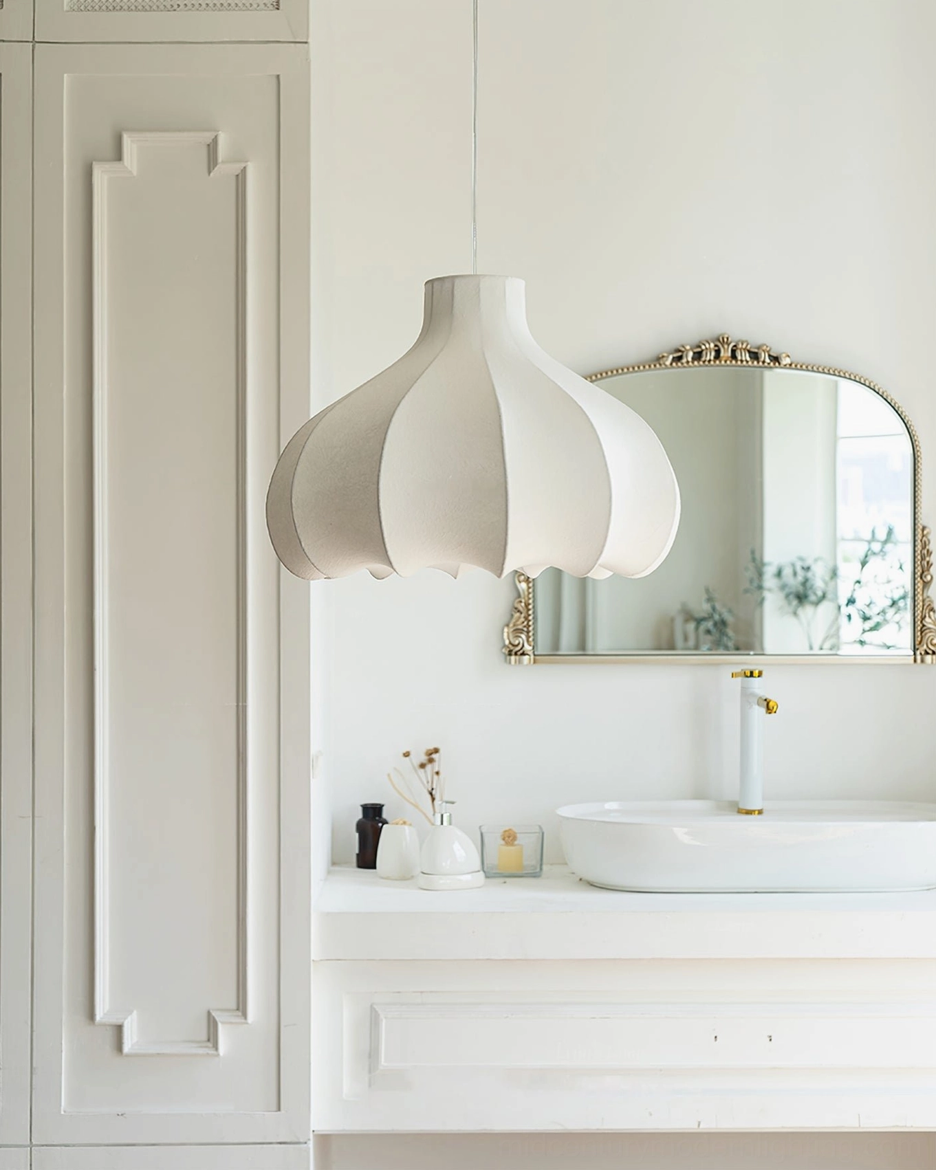 White fluted silk pendant lamp hanging in French-style bathroom, elegant minimalist interior design