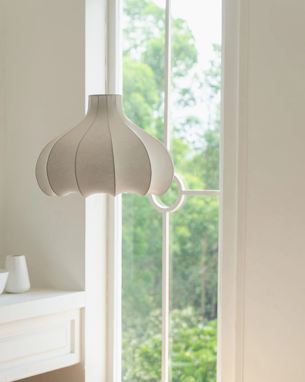 Grey fluted cocoon pendant lamp in sunlit bathroom with greenery, neutral minimalist decor aesthetic