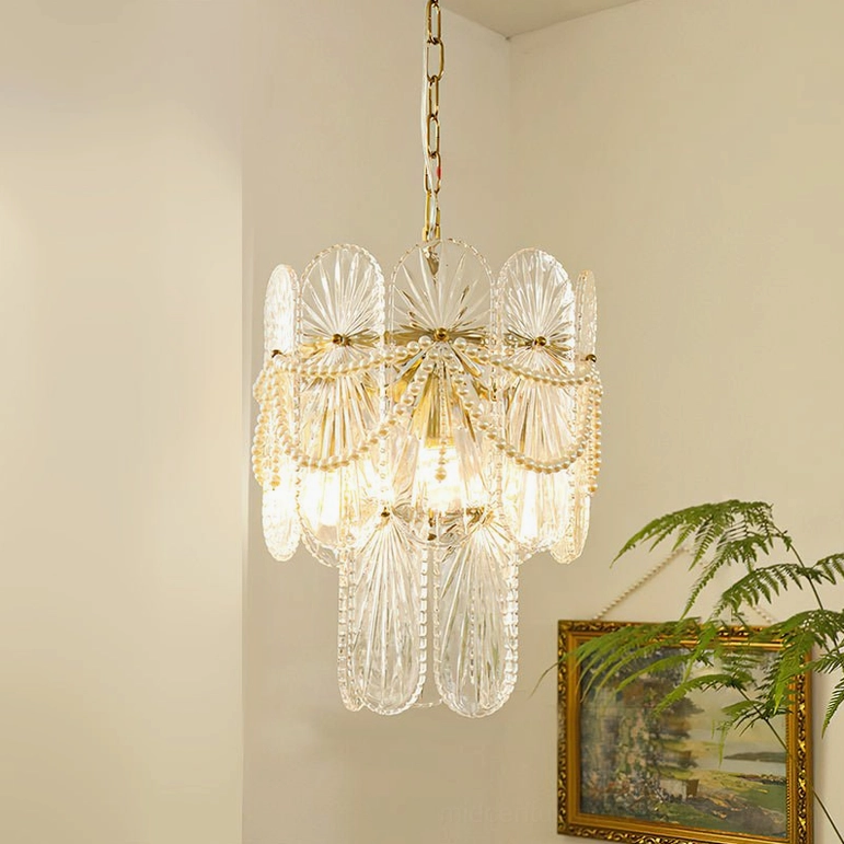 Compact 3-light Art Deco glass chandelier with ribbed panels and pearl beaded strands in room setting