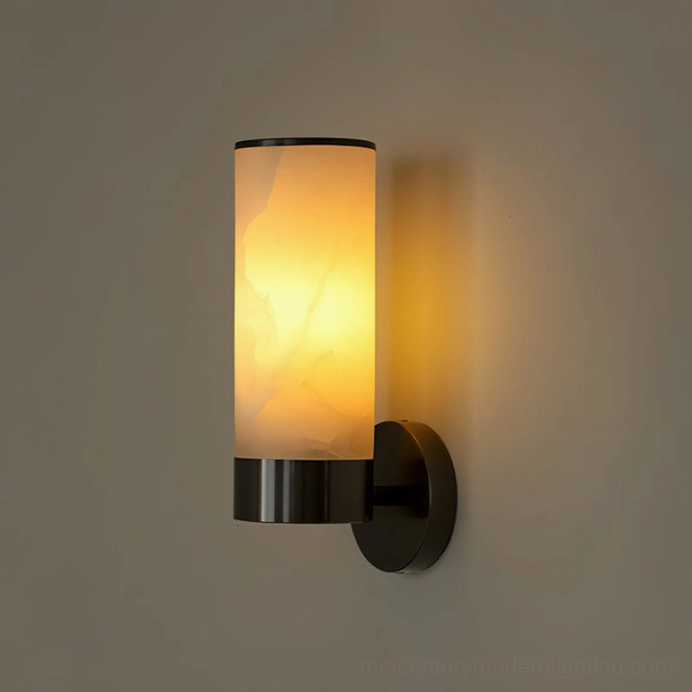 Matte black and white alabaster wall sconce compact size, side view on gray background with illuminated warm glow