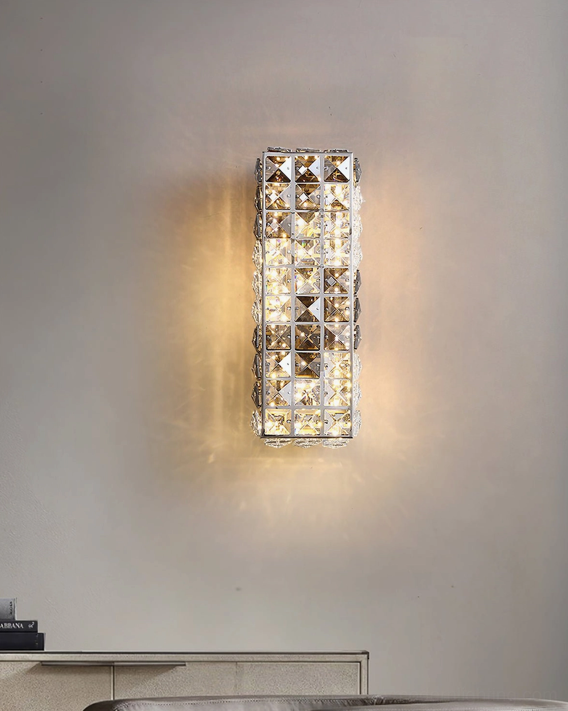 Compact crystal wall sconce frontal view showing clean stainless steel frame and geometric crystal design