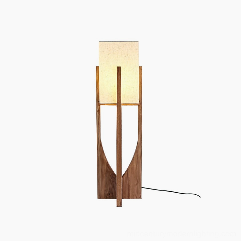 Compact Fairbanks floor lamp in bedroom corner showing bedside placement and warm lighting effect