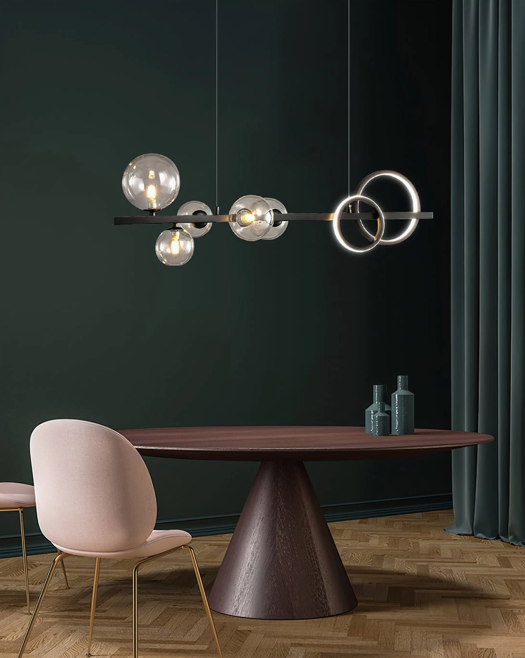 Compact modern pendant chandelier with clear glass bubbles and gold accents against dark green wall in minimalist dining space